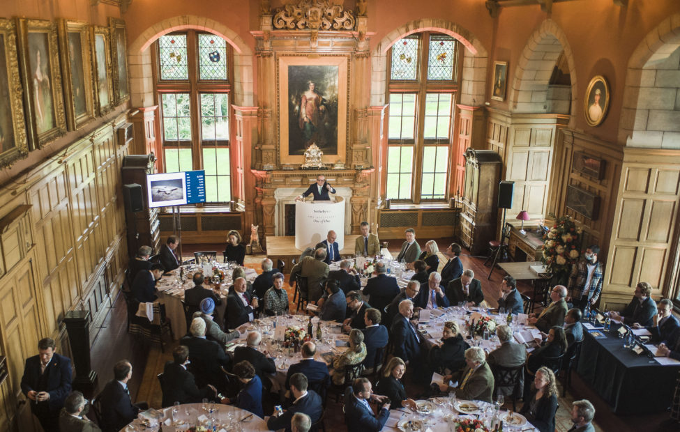 Jamie Ritchie fielding bids during The Distillers One of One auction Barnbougle Castle 3 Dec 2021